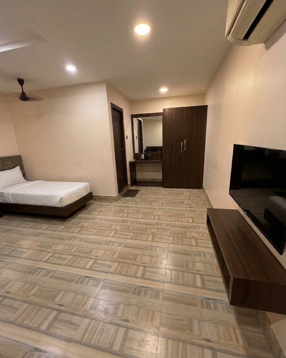 Premium room — TV & wardrobe