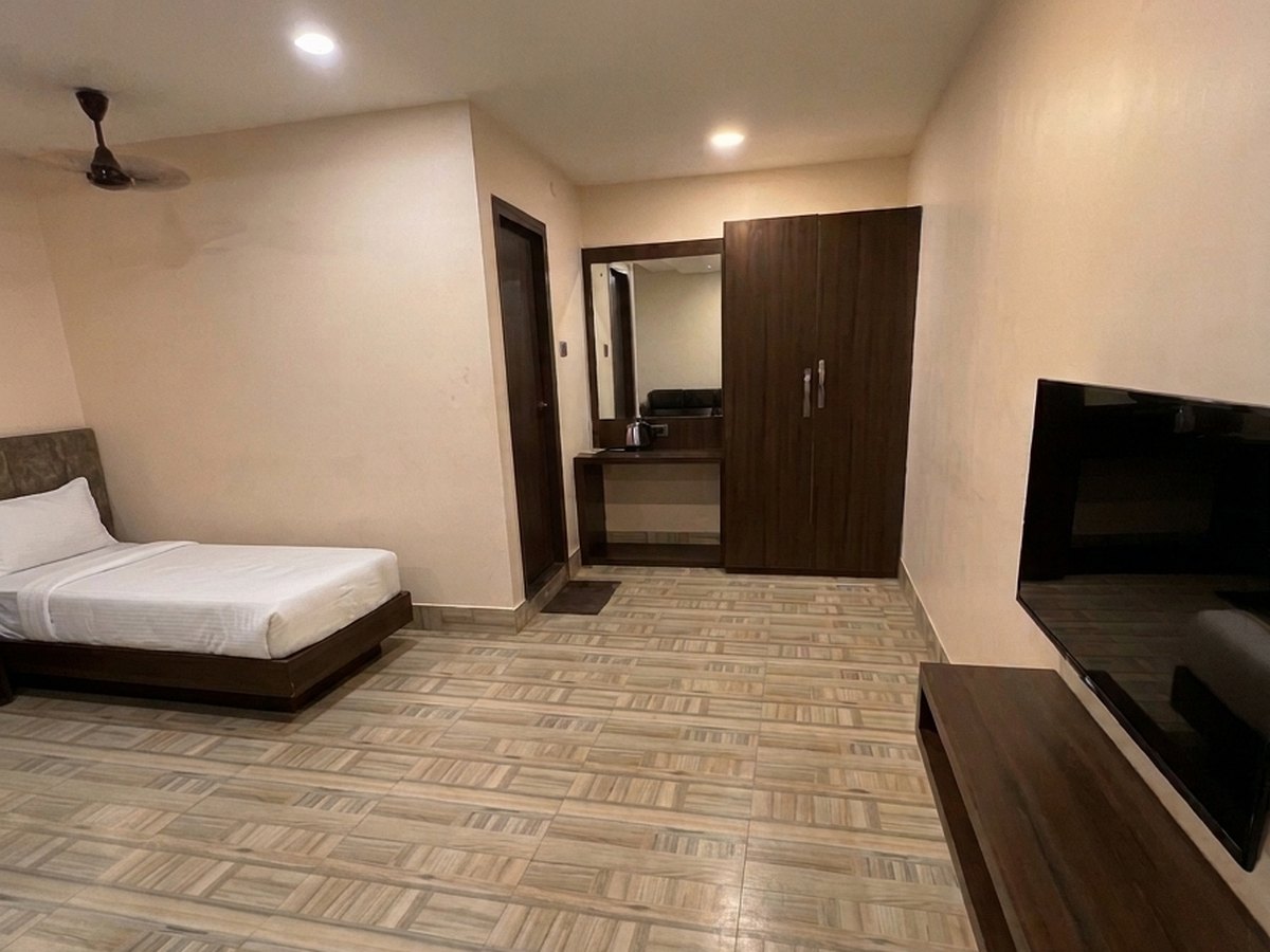 Premium room — TV & wardrobe